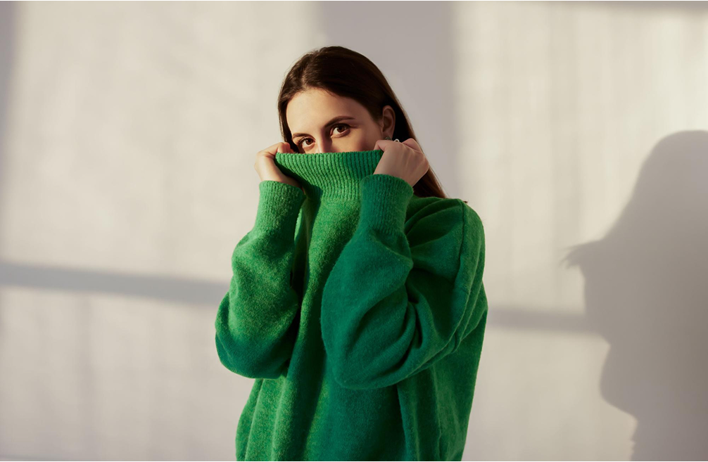 Image of girl in green high-neck